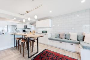 a kitchen with a table and chairs and a couch at Hidden Cove Unit 6 in Holmes Beach +23 photos