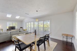 a living room with a table and a couch at Spring Oasis in Anna Maria