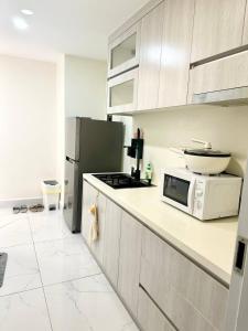 a kitchen with a counter with a microwave and a stove at Julia Koch Houde in Esslingen
