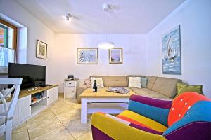 a living room with a couch and a table at Villa Valentina with pool and close to beach in Selca