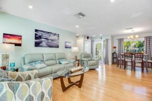 a living room with a couch and a table at Almost There in Bradenton