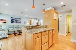 a kitchen with a large island in a living room at Almost There in Bradenton
