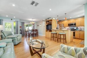 a living room with a couch and a table at Almost There in Bradenton