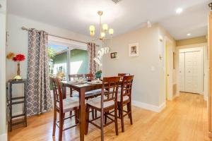 a dining room with a table and chairs at Almost There in Bradenton +29 photos