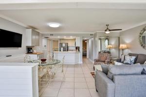 a living room with a couch and a table at Midnight Cove II 823 in Siesta Key