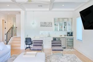 a white living room with a white couch and chairs at Gulf View Estate in Anna Maria +42 photos