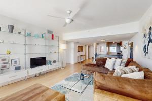 a living room with a couch and a fireplace at Island Time Hideaway in Longboat Key