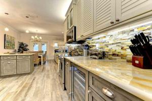 a large kitchen with a counter and a counter top at Wine Down in Ilexhurst