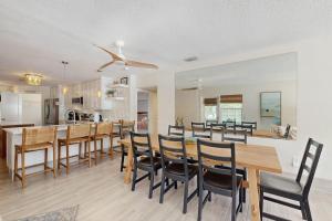 a kitchen and dining room with a table and chairs at King Crab in Holmes Beach