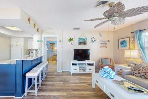 a living room with a hospital room with a waiting room at The Villas, Condo 1A in Holmes Beach