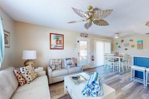 a living room with a couch and a table at The Villas, Condo 1A in Holmes Beach