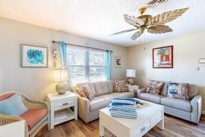 a living room with a couch and a table at The Villas, Condo 1A in Holmes Beach
