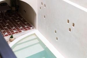 a view from the top of a room with a tile floor at Moreira Hotel Boutique in Mérida +42 photos