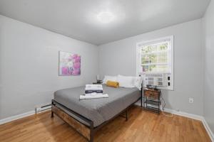 a bedroom with a bed and a window at Charming 1930s Style Rustic Home in Eugene