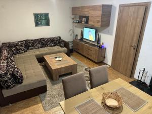 a living room with a couch and a table at House Apartment Azra in Sarajevo