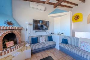 a living room with two couches and a fireplace at MarBrisas 3 Bed 2 Bath in Puerto Peñasco +16 photos