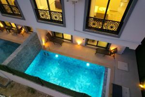 an overhead view of a swimming pool in a building at Villa A1 Canpare in Fethiye
