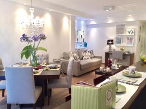 a dining room and living room with a dining table at Luxury Apartment Tagle with flexible Chek in or Check out in Buenos Aires