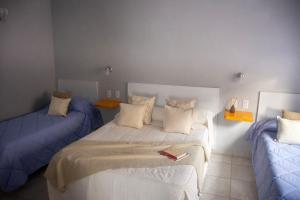 a bedroom with a bed and a couch at Sitios del Sol 1 in General Acha
