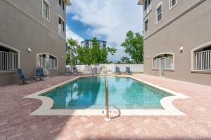 a swimming pool in the middle of a building at White Cap Condo B201 by Sun Palace Vacations in Fort Myers Beach