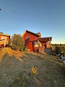 a house with a yard in front of it at Casa Quento in Castro +13 photos