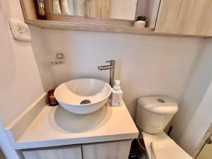 a small bathroom with a sink and a toilet at Posada del Quindío 0219 in Armenia