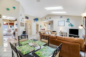 a living room with a couch and a table at Bella Villa in Bradenton