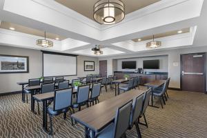 a classroom with tables and chairs and a chalkboard at Best Western Plus Overland Inn in Fort Morgan +36 photos