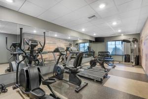 a gym with treadmills and elliptical machines at Best Western Plus Overland Inn in Fort Morgan