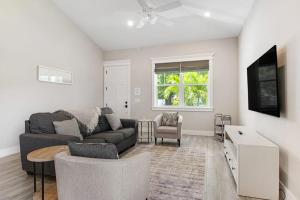 a living room with a couch and a table at Friendly City Fun in Bradenton