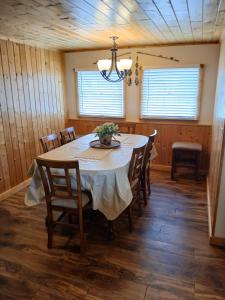 a dining room with a table and some chairs at Back Bay Getaway in Hayward
