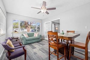a living room with a dining room table and chairs at Don't Be Koi in Bradenton