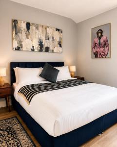a bedroom with a large bed in a room at The Promenade House in New Brighton