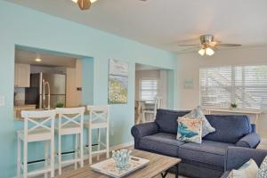 a living room with a couch and a table at Bungalow A in Bradenton Beach