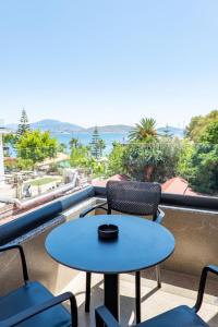 a table and chairs on a balcony with a view of the ocean at ADORA's VIEW HOTEL in Sarandë +150 photos