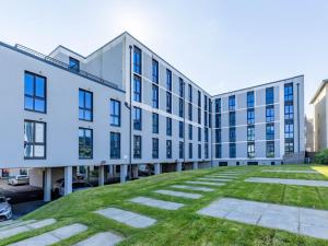 a large white building with a lawn in front of it at ABeleven in Aberdeen