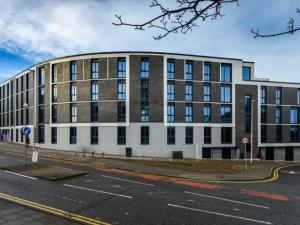 a large brick building on a city street at ABeleven in Aberdeen
