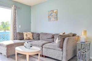 a living room with a couch and a table at Bungalow W in Bradenton Beach