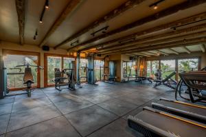 an indoor gym with treadmills and exercise equipment at Aqua de Mar Condo Hotel in Icaraí
