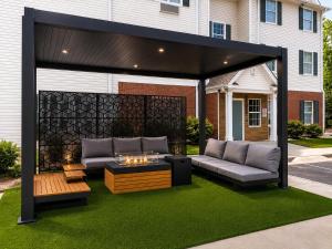 a pergola with a couch and a table at MainStay Suites Columbia Harbison in Harbison