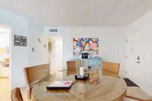 a living room with a table and chairs at Gulf Place 20 in Holmes Beach