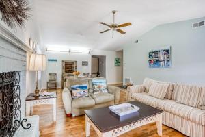 a living room with a couch and a table at Manatee River House in Bradenton