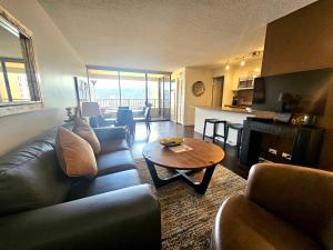 a living room with a couch and a table at Discovery Bay 3517 in Honolulu