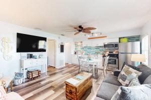a living room with a couch and a table at Nautical Nook at Bayview Inn in Bradenton Beach