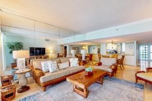 a living room with a couch and a table at Paradise Time Hideaway in Longboat Key
