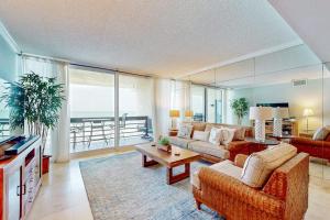 a living room with a couch and a table at Paradise Time Hideaway in Longboat Key