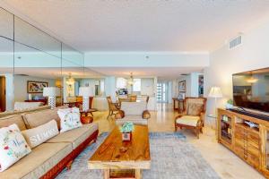 a living room with a couch and a table at Paradise Time Hideaway in Longboat Key