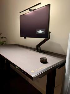 a desk with a computer monitor and a mouse on it at Apartamenty Cisza - Ustrzyki Dolne noclegi - Bieszczady noclegi in Ustrzyki Dolne +26 photos