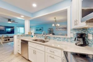 a kitchen with a sink and a counter top at Gulf Place 19 & 20 in Holmes Beach