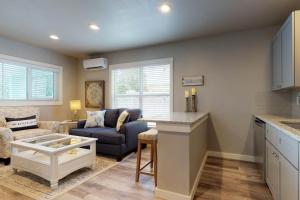 a kitchen and living room with a couch and a table at South Bay Inn 3 in Anna Maria